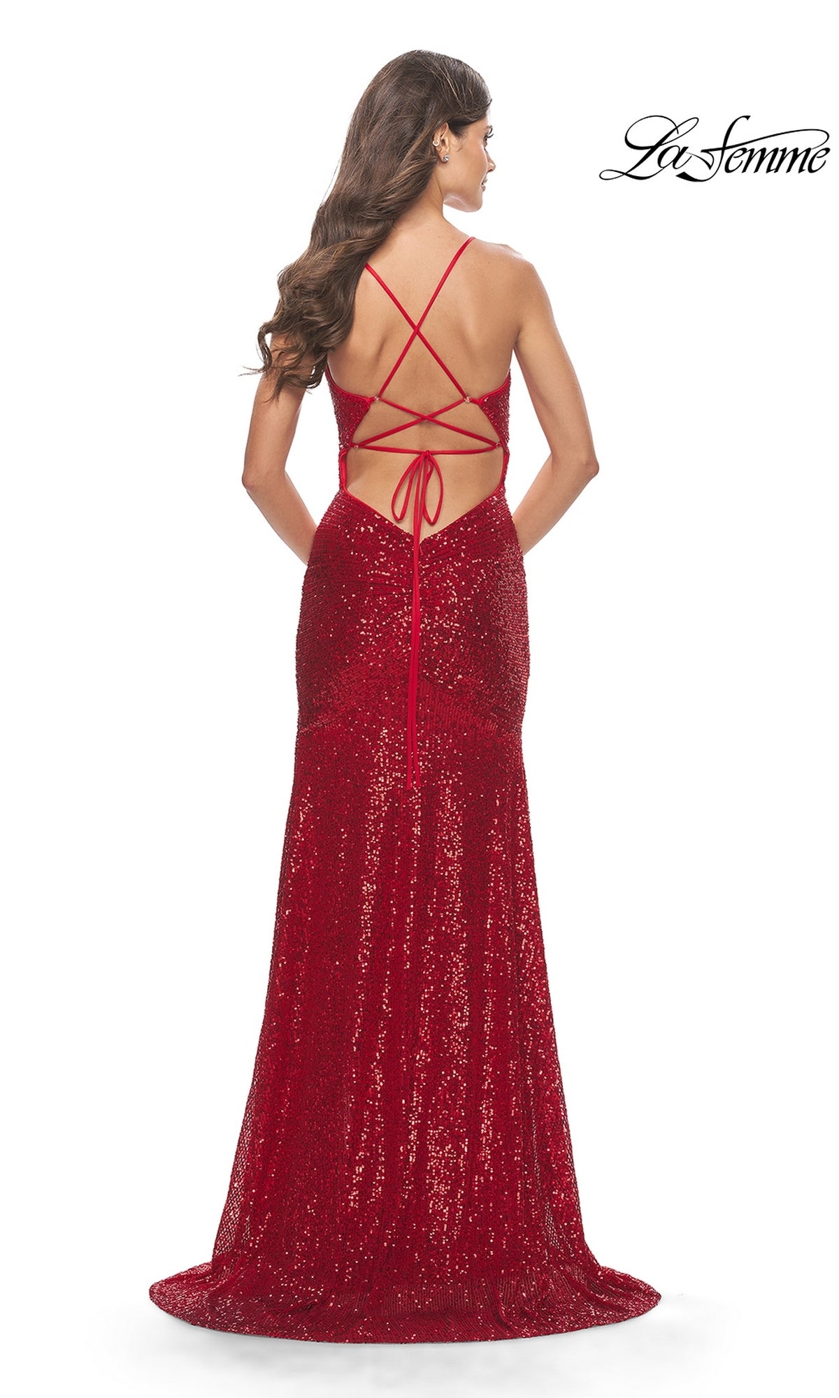 A woman faces away from the camera wearing a V-Neck Long Sequin Backless Prom Dress with an open, crisscross lace-up back in red, featuring floor-length sequins for an elegant evening look.